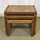 Set of 3 nesting tables in teak with tiled tops.