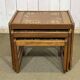 Set of 3 nesting tables in teak with tiled tops.