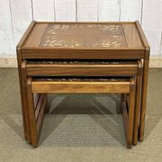 Set of 3 nesting tables in teak with tiled tops.