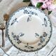 Antique earthenware dessert plates accompanied by a dish