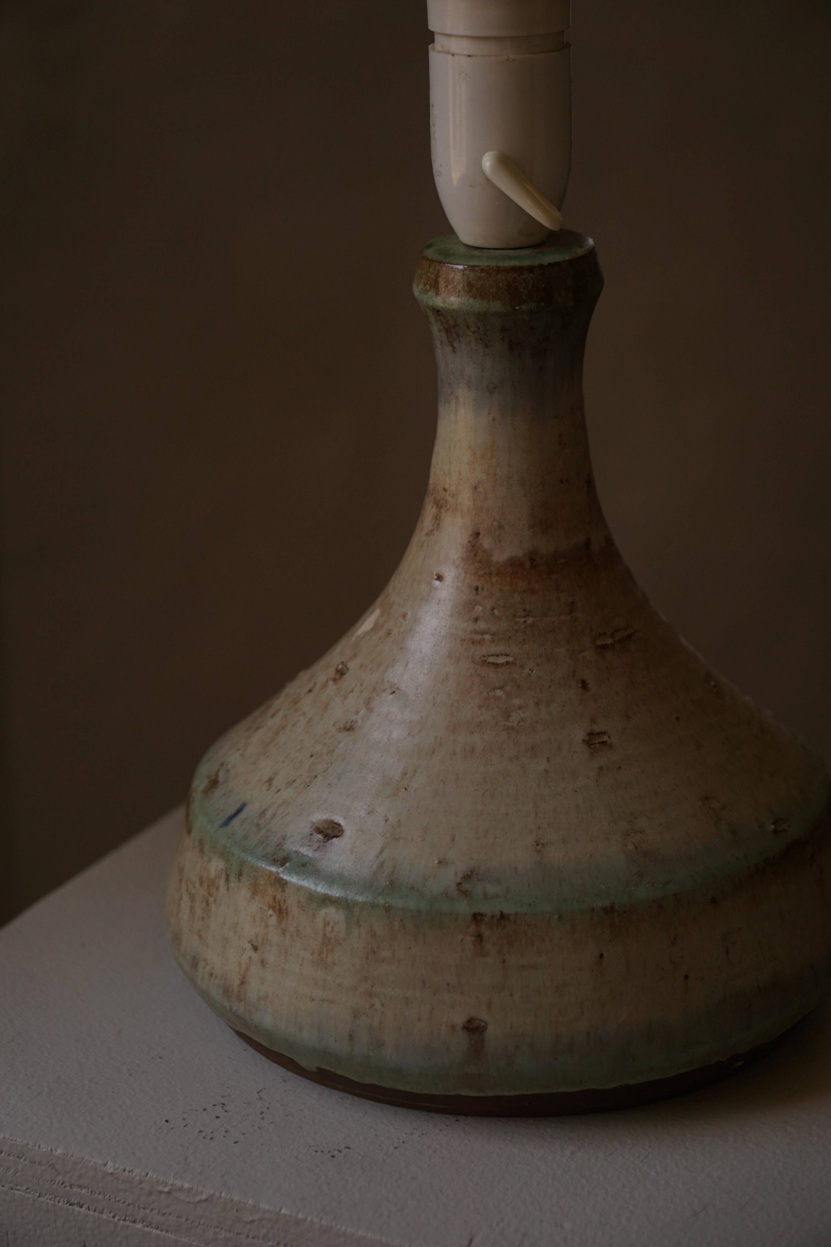 Modern Danish decorative table lamp in stoneware with flared base, Denmark, 1960s.