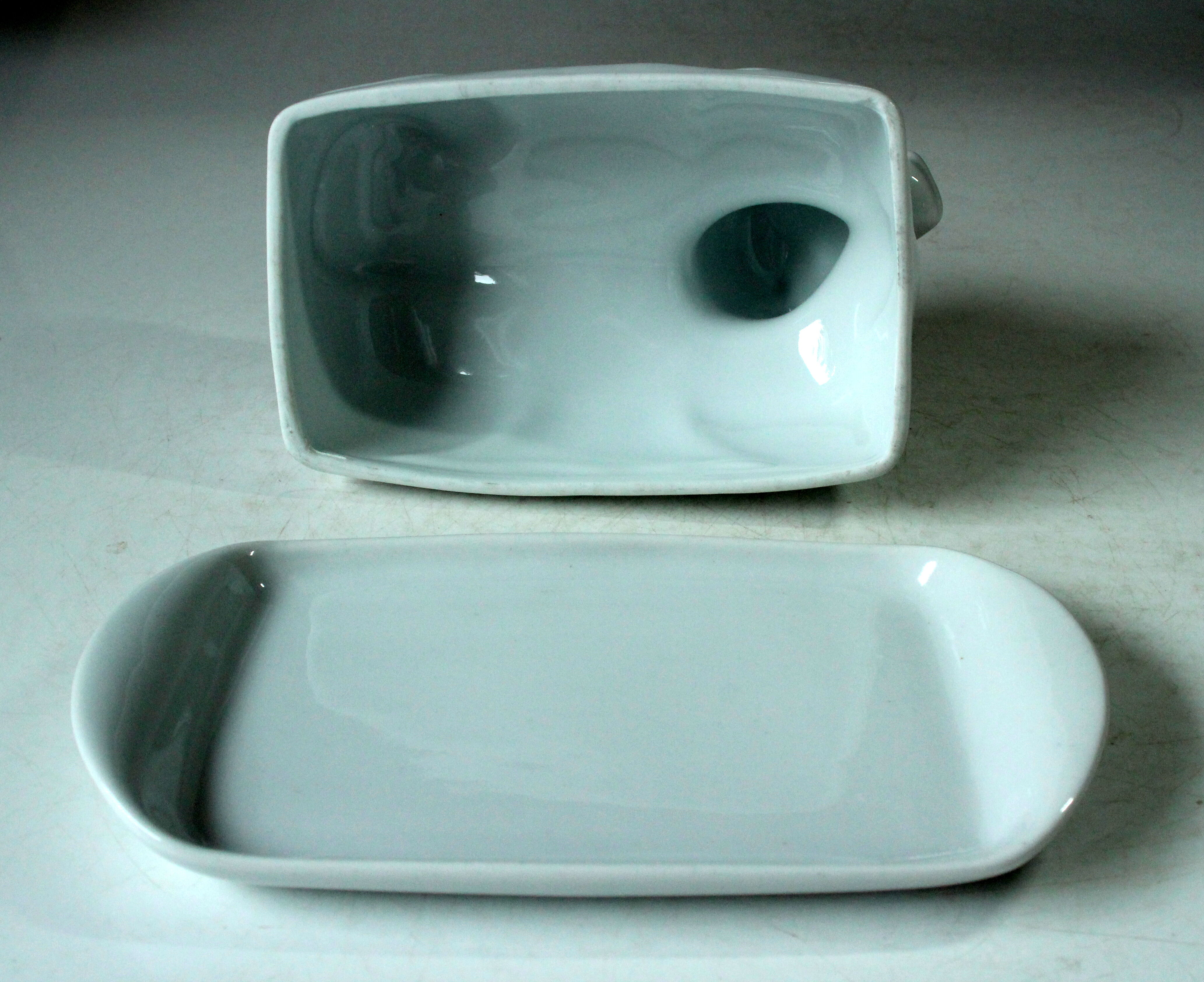 White ceramic butter dish in the shape of a cow, vintage