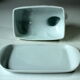 White ceramic butter dish in the shape of a cow, vintage