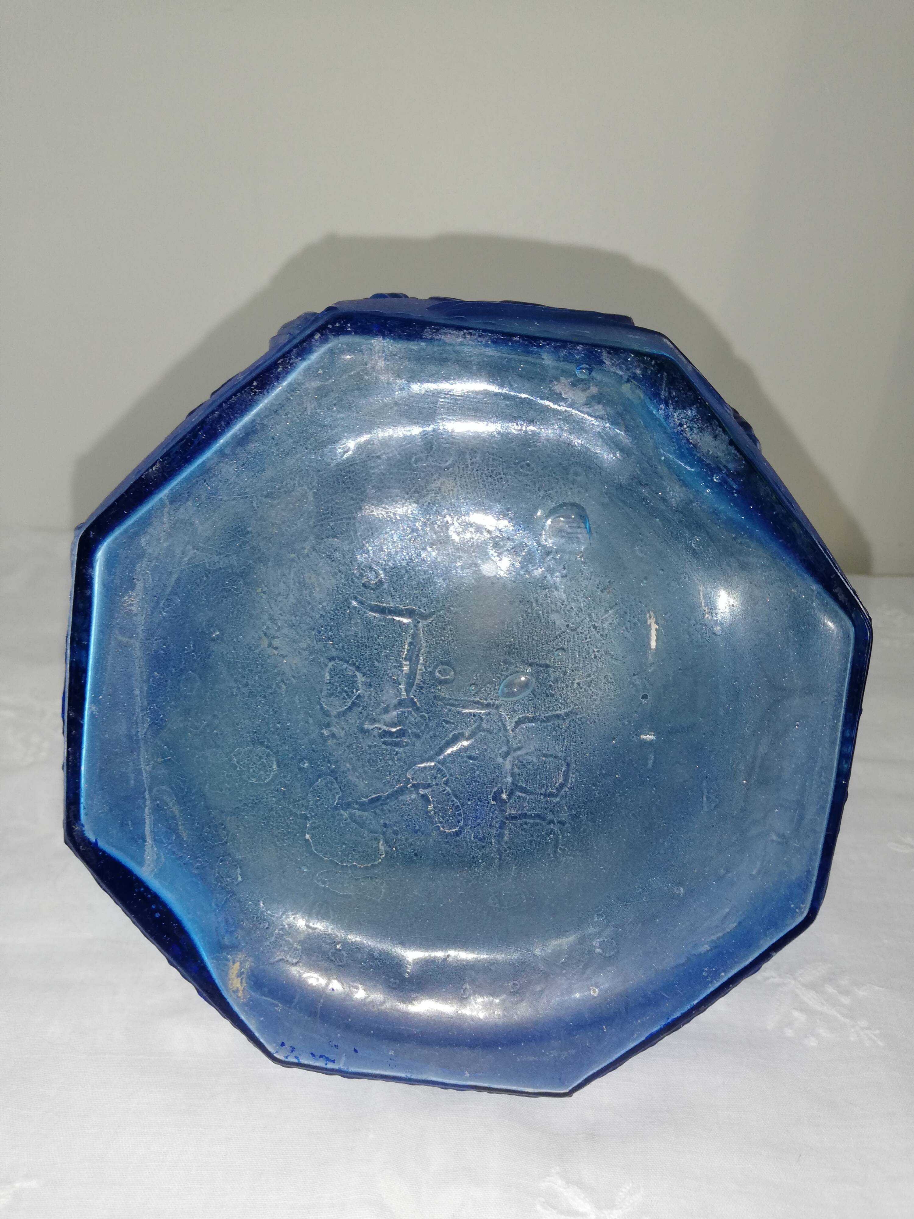 Blue glass bottle, engraved molded