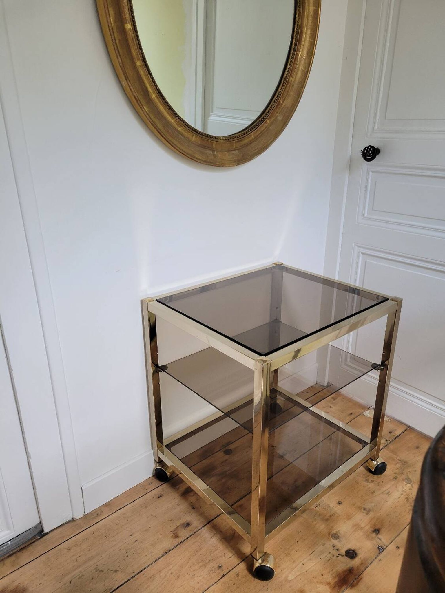 Gold metal and smoked glass serving trolley