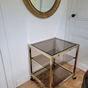 Gold metal and smoked glass serving trolley