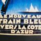 Plaque publicitaire pour le train bleu