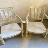 A pair of low armchairs