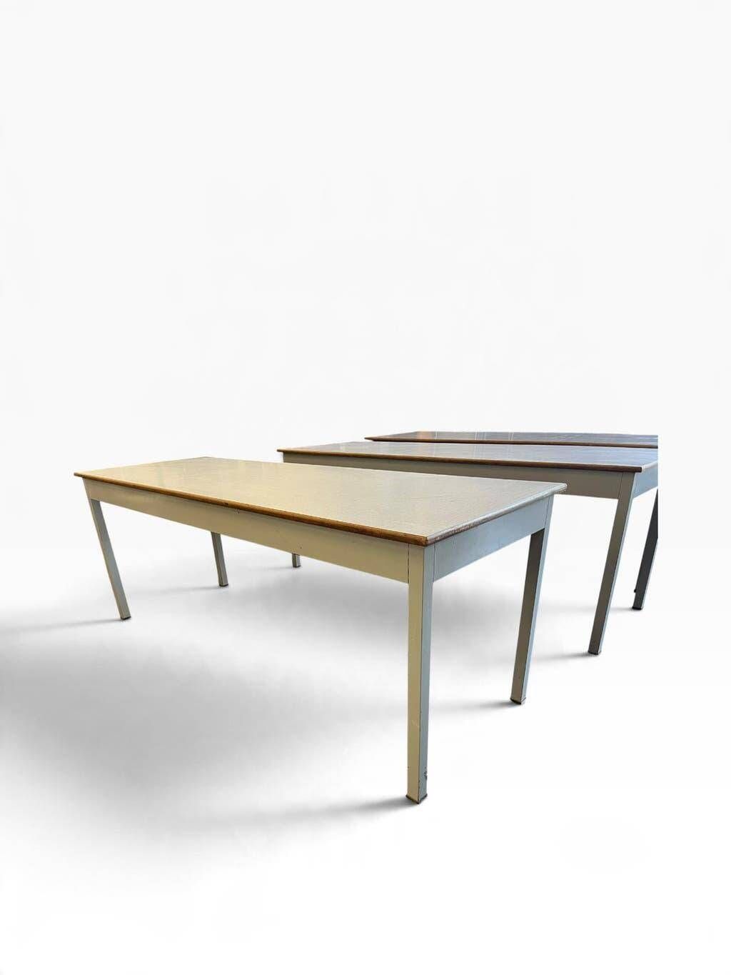 Vintage industrial table with a Formica top and wooden accents.