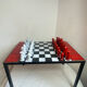 Chess set with ceramic board and pieces.
