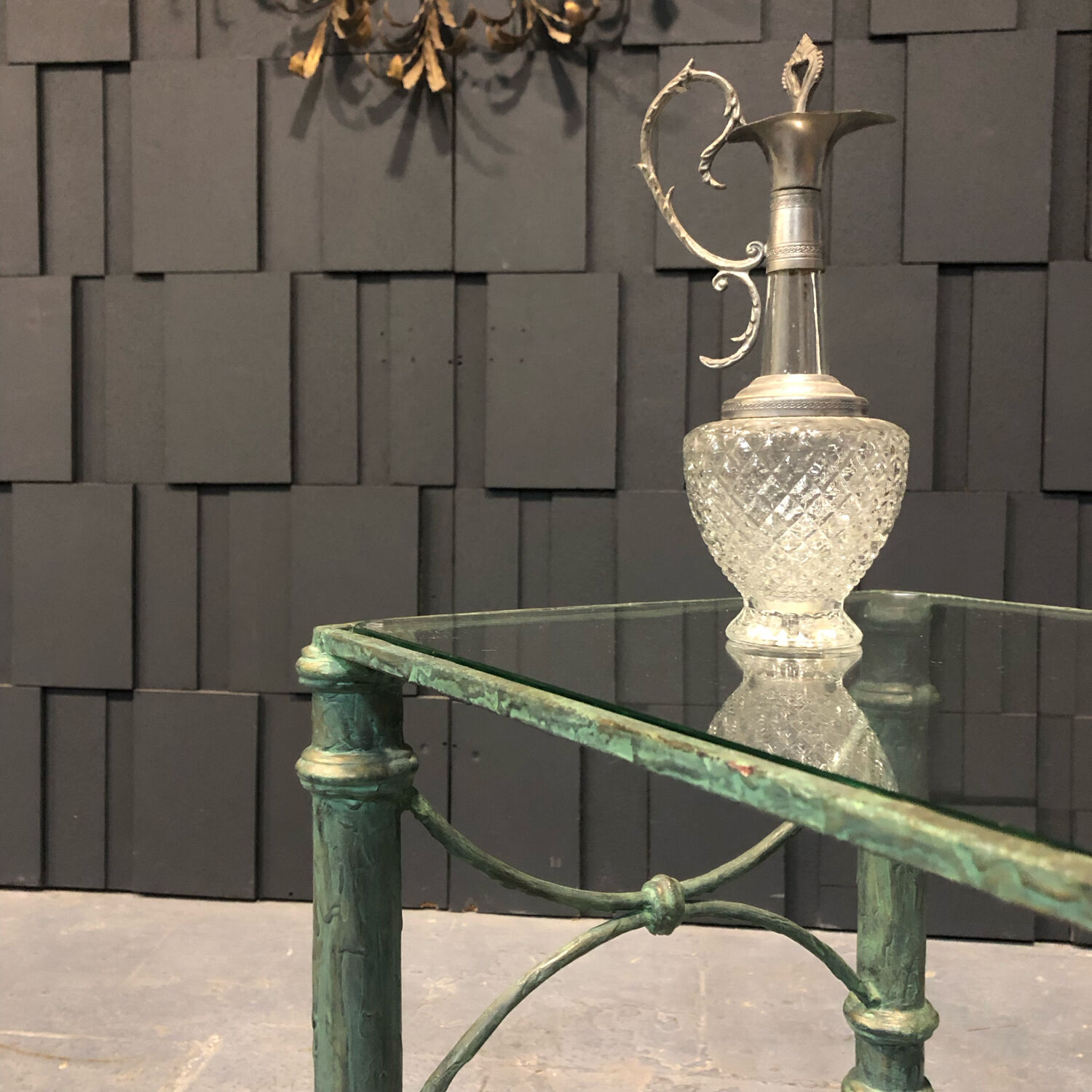 Iron and glass side table with antique patina