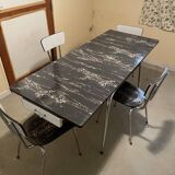 Table and 4 chairs in Formica.
