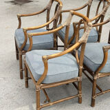 Set of 4 vintage McGuire rattan chairs with cushions.