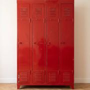Vintage industrial wardrobe with 4 metal doors in red.