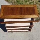 Chest of drawers with decorated handles in the Louis XVI style.