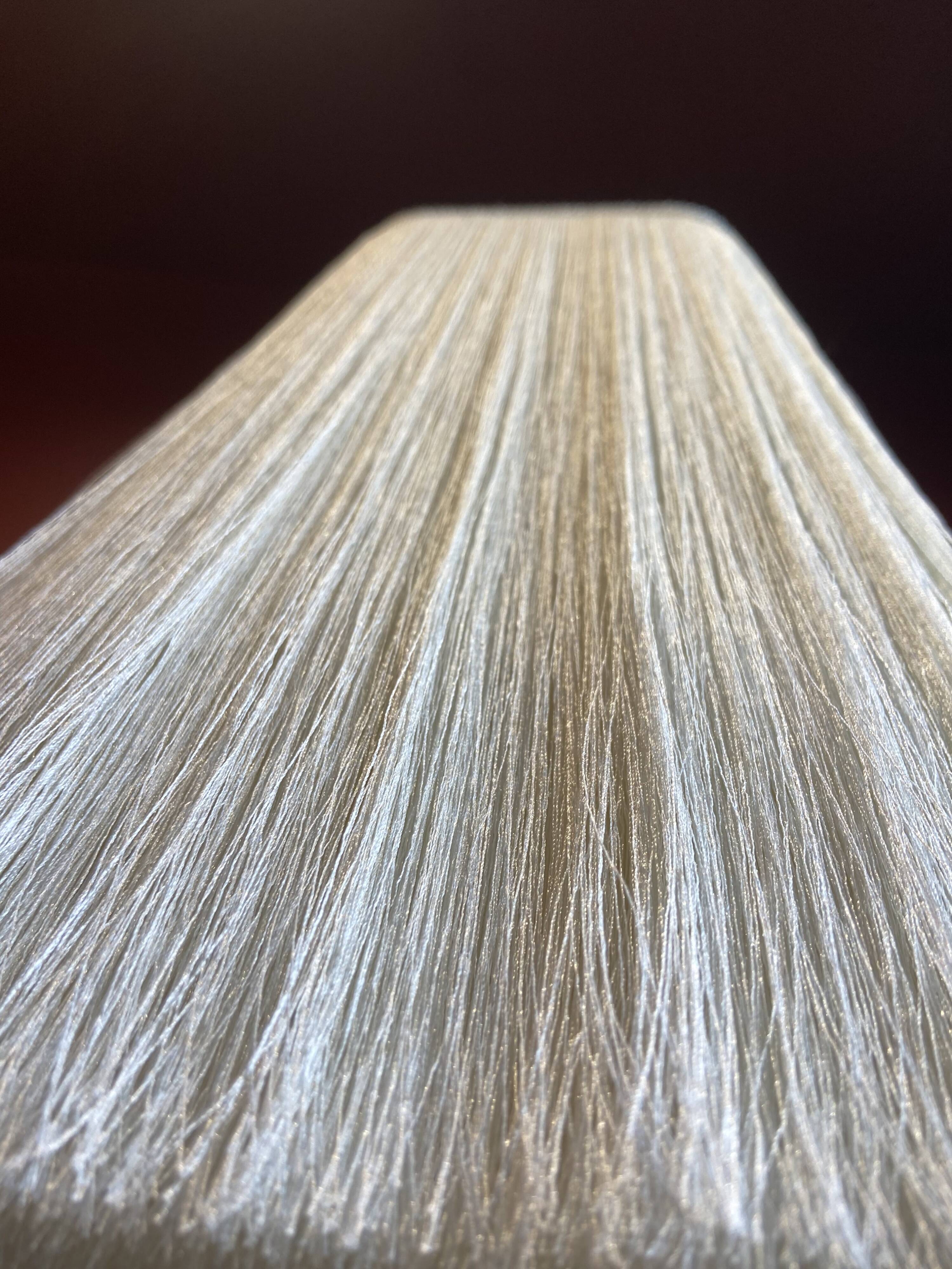 Beige marble stucco base, Houles white ecru fringed lampshade.