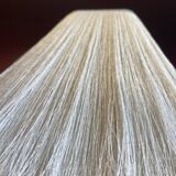 Beige marble stucco base, Houles white ecru fringed lampshade.