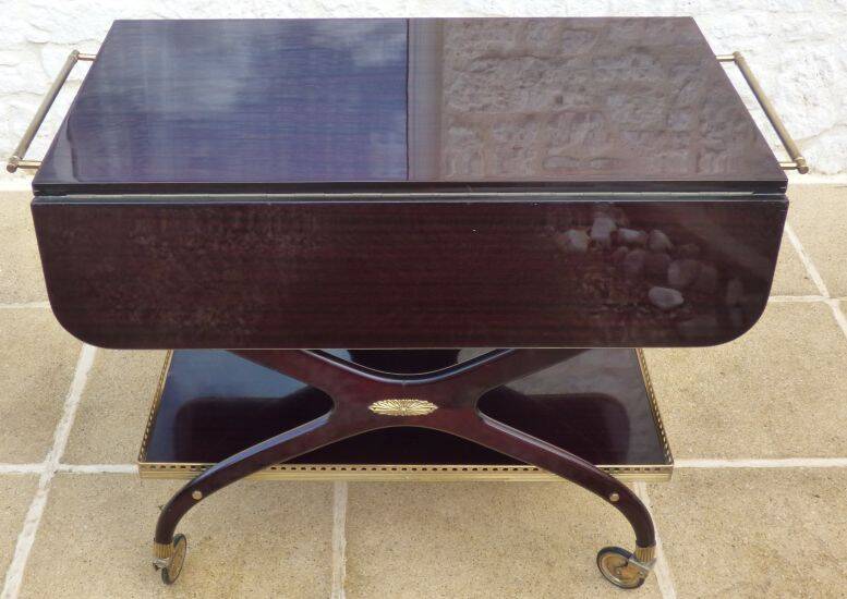 Chic serving table on wheels from the 60s with brass decorations and two shelves.