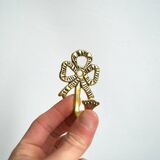 Trio of brass coat hooks