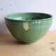 Large glazed ceramic salad bowl with a floral design.
