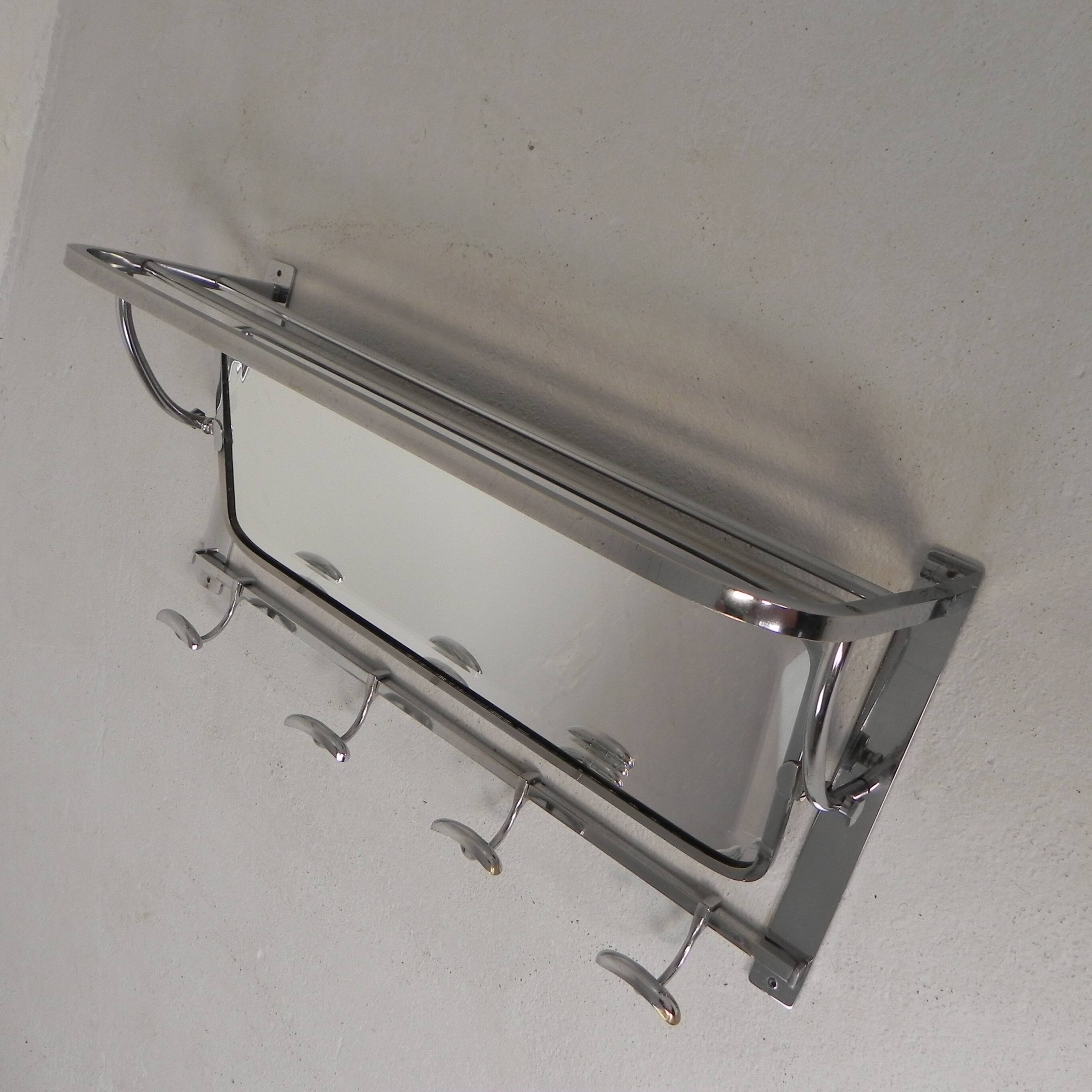 Art Deco wall coat rack with a bevelled mirror adjustable in a chrome frame, 1930s.