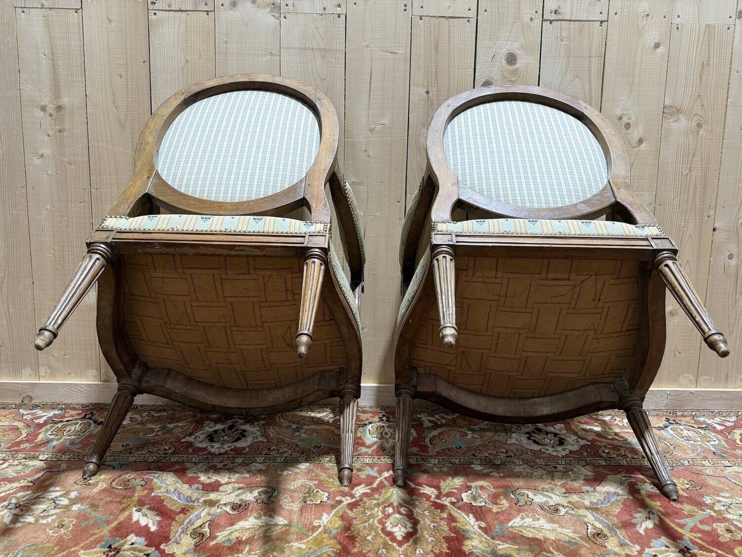 Pair of cabriole armchairs with medallion backs from the Louis XVI period, stamped OT.