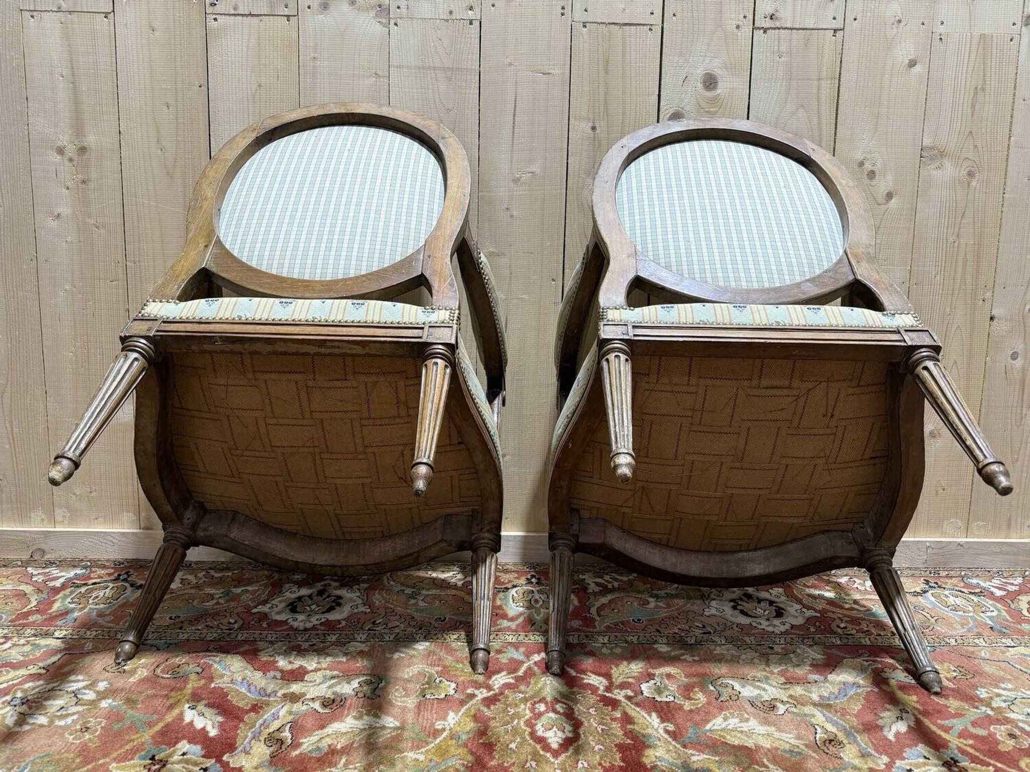 Pair of cabriole armchairs with medallion backs from the Louis XVI period, stamped OT.