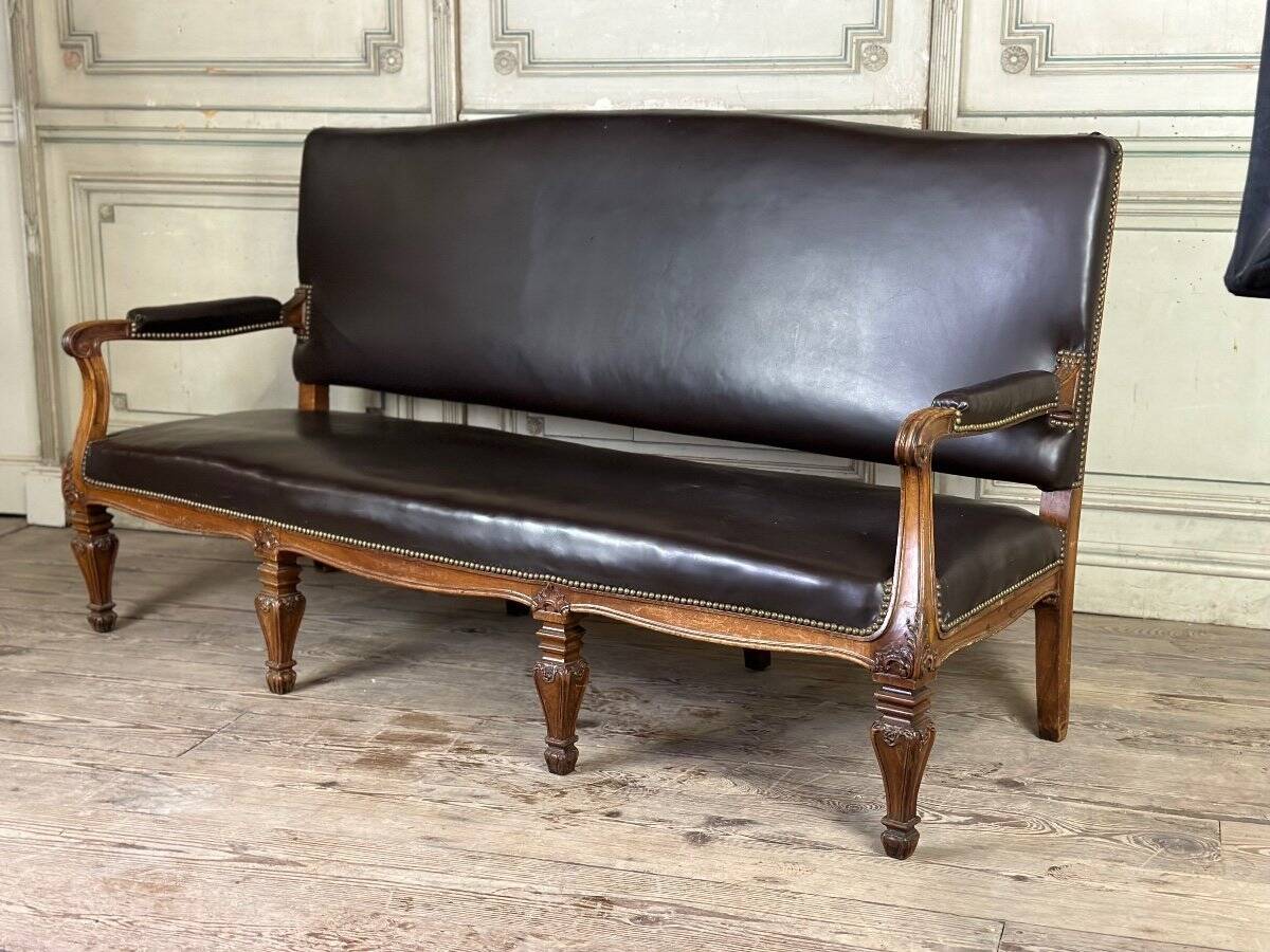 Napoleon III style bench in carved walnut, synthetic leather circa 1880
