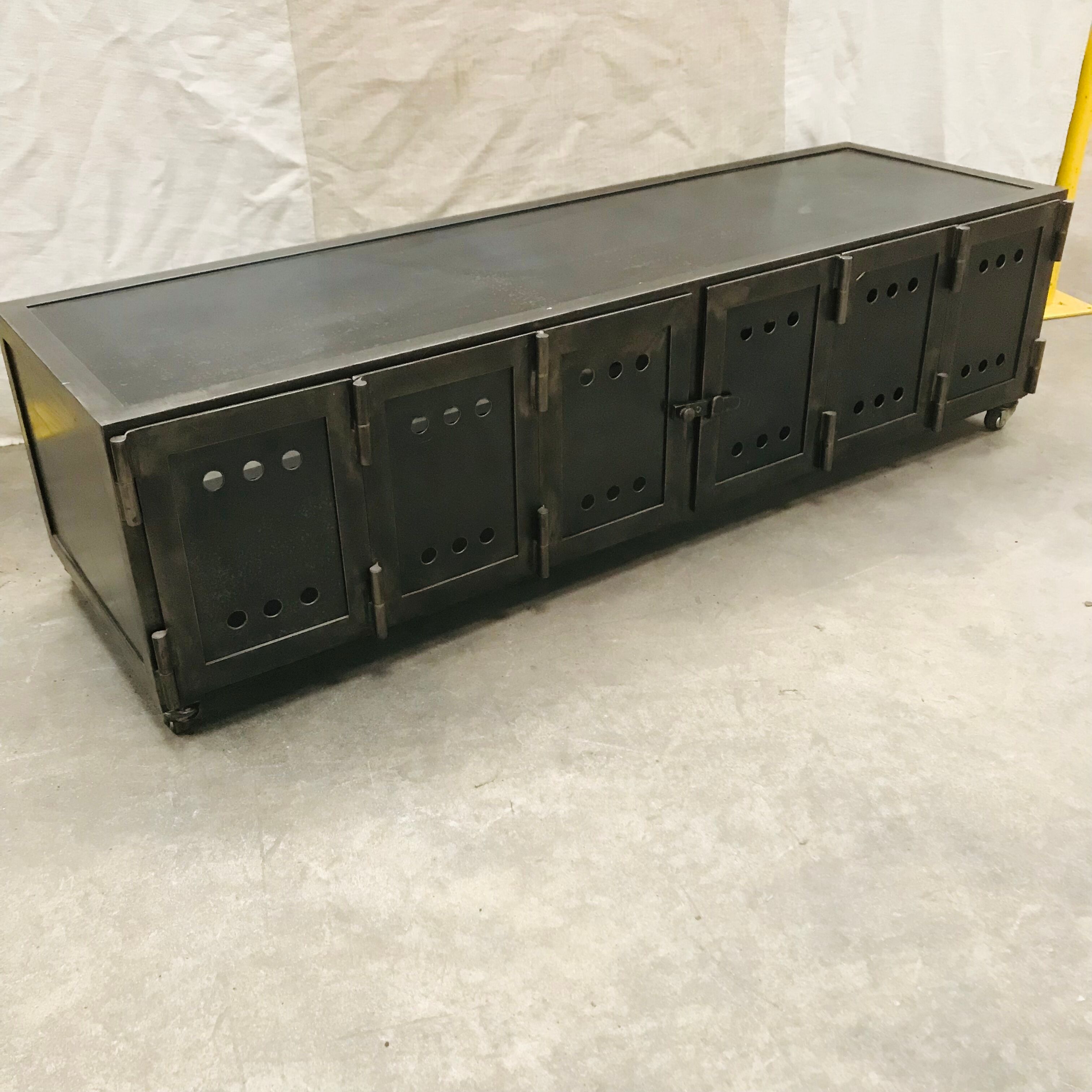 TV stand with natural steel accordion doors