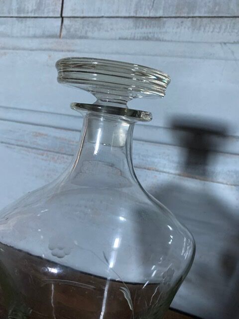 Glass carafe engraved with flowers