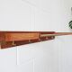 Wall coat rack with hat rack made of teak and gold metal,