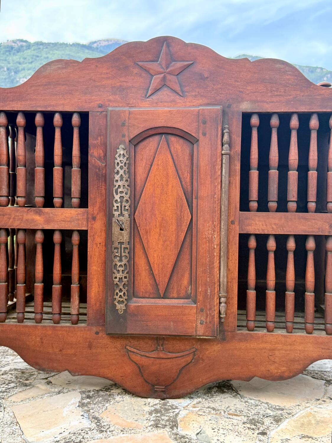 Molded and carved walnut panetière, 19th century.