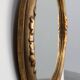 Art Deco oval gilt oak mirror, Belgium 1920s