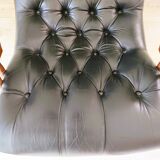 Black leather rocking Chesterfield armchair