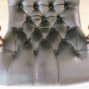 Black leather rocking Chesterfield armchair