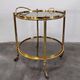 Hollywood Regency bar cart in bronze and smoked glass, 1950s