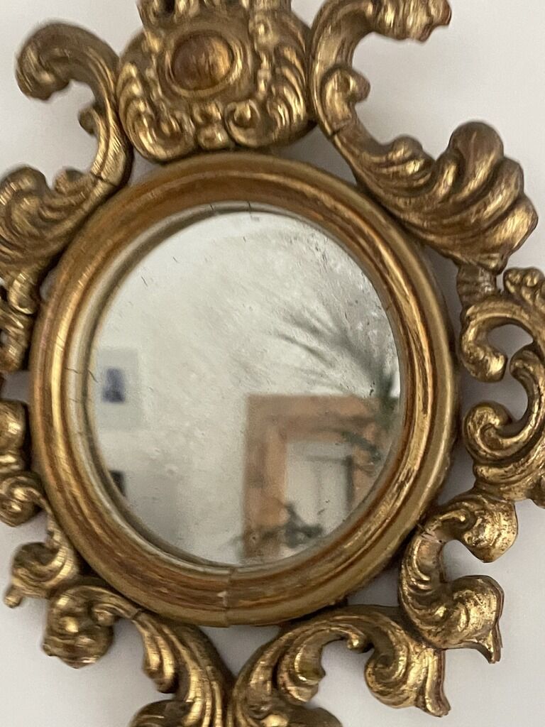 Old mirror in gilded wood