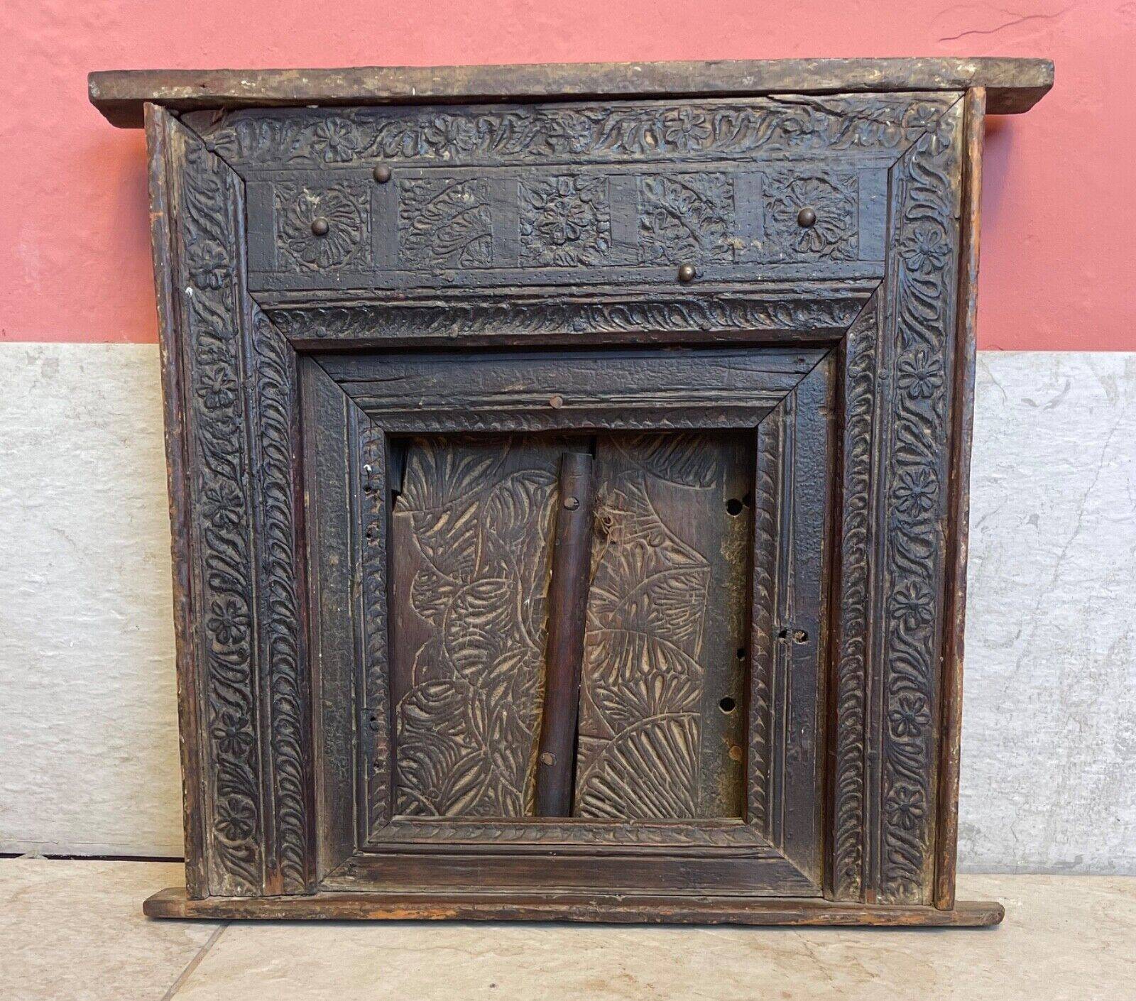 Old Indian window with carved decoration of flowers and foliage 19th century