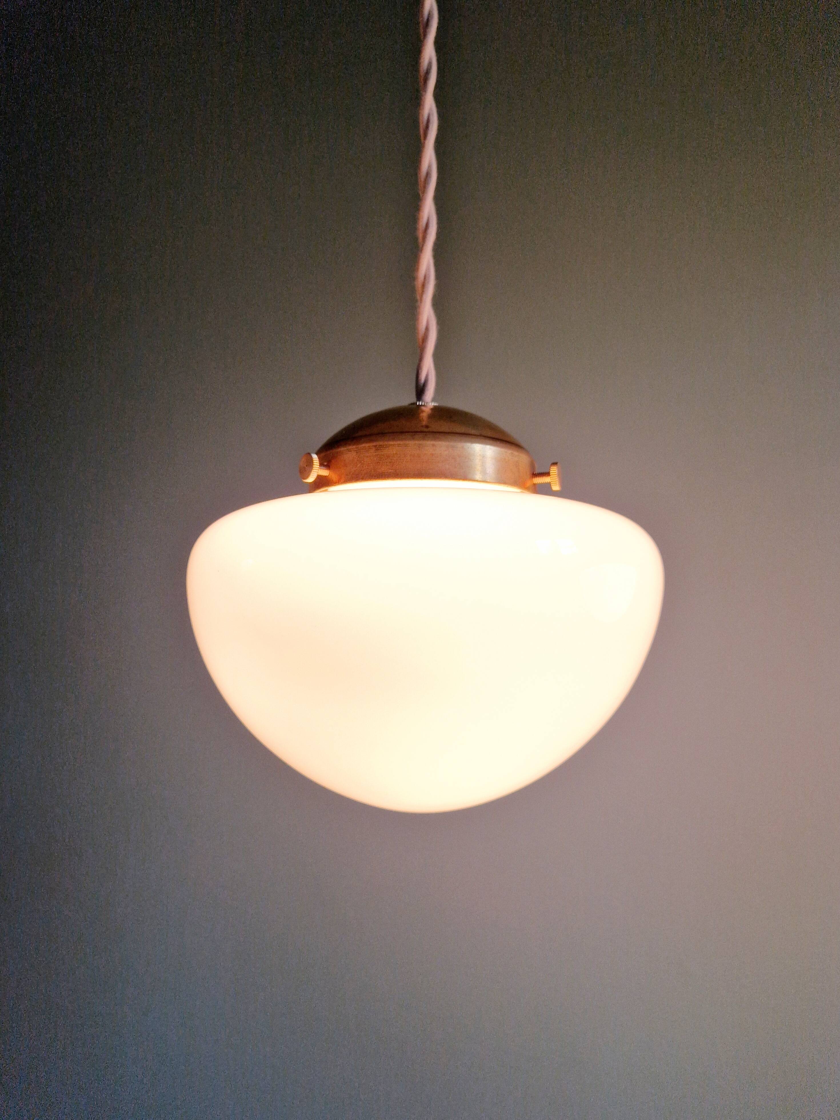 Duo of Art Deco suspensions in white opaline, 1920s-30s