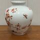 Vase decorated with birds and butterflies