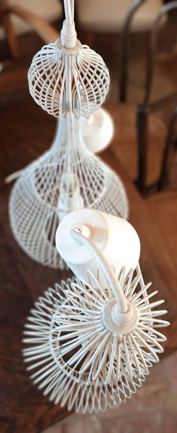 Pair of white metal pendant lights