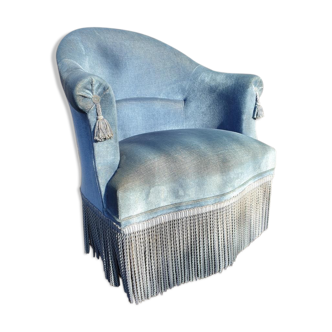 Blue velvet toad chair with fringes and pom poms