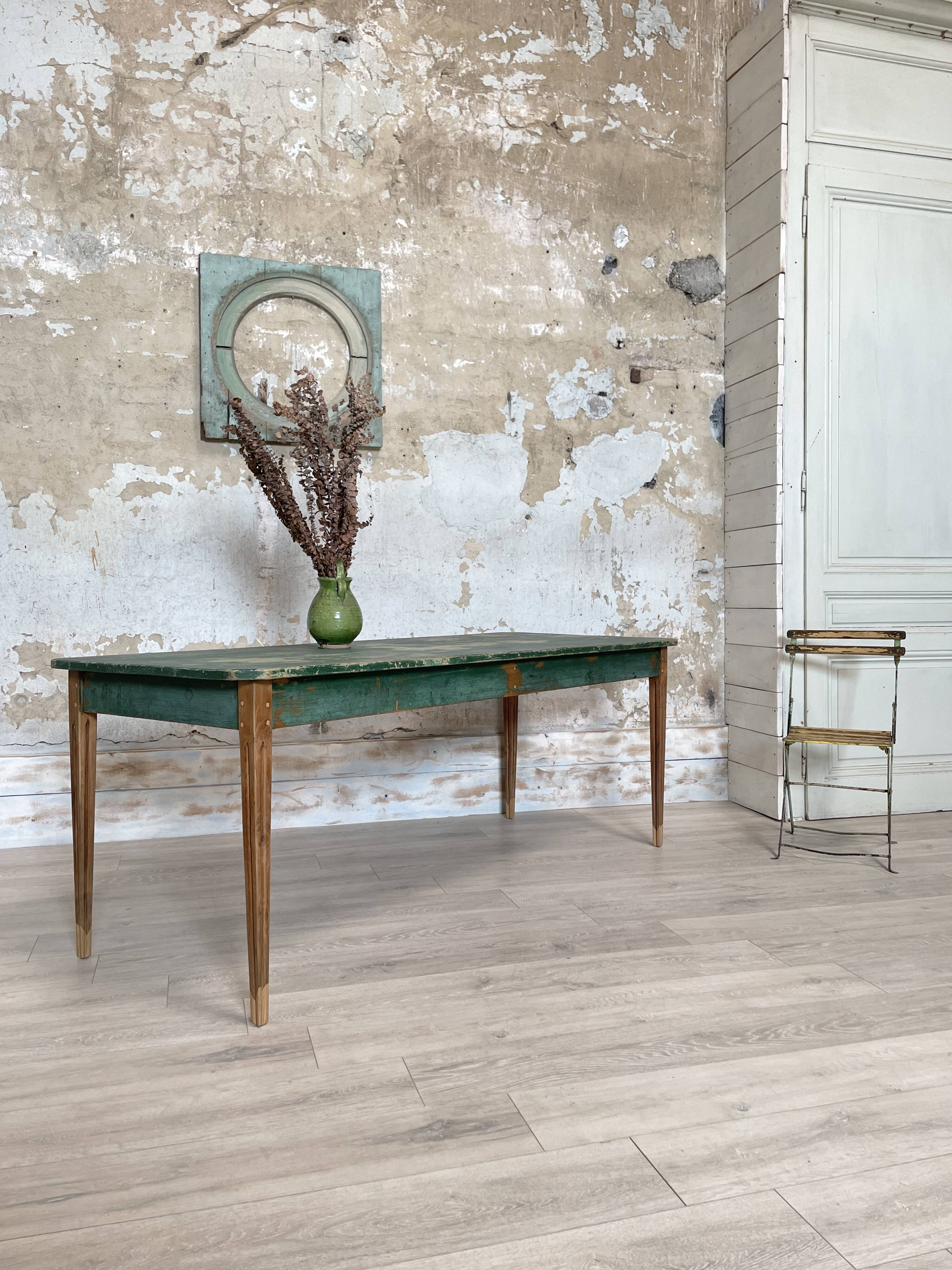 Vintage farm table with spindle legs.