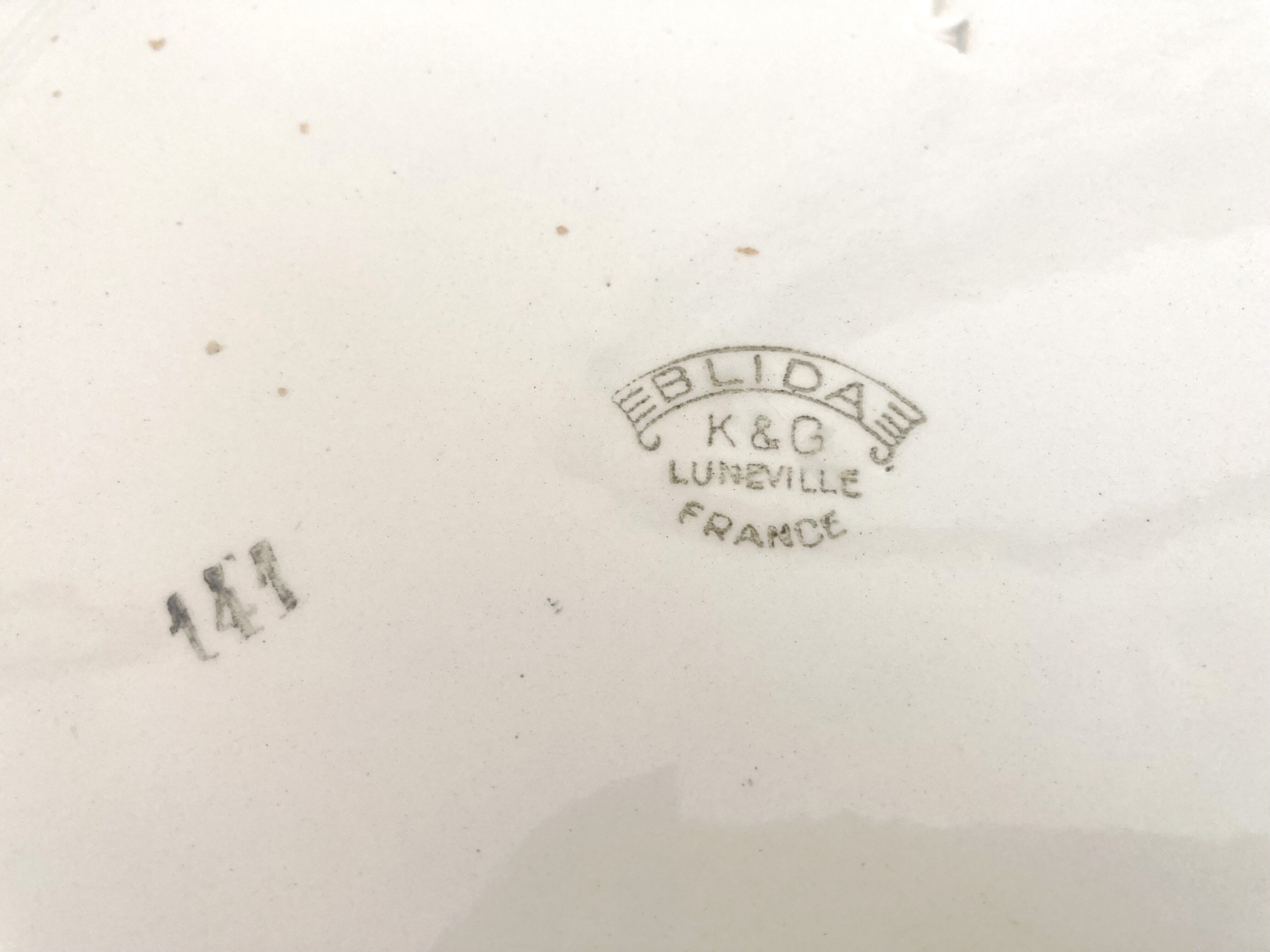 Round serving dish with burgundy red floral pattern