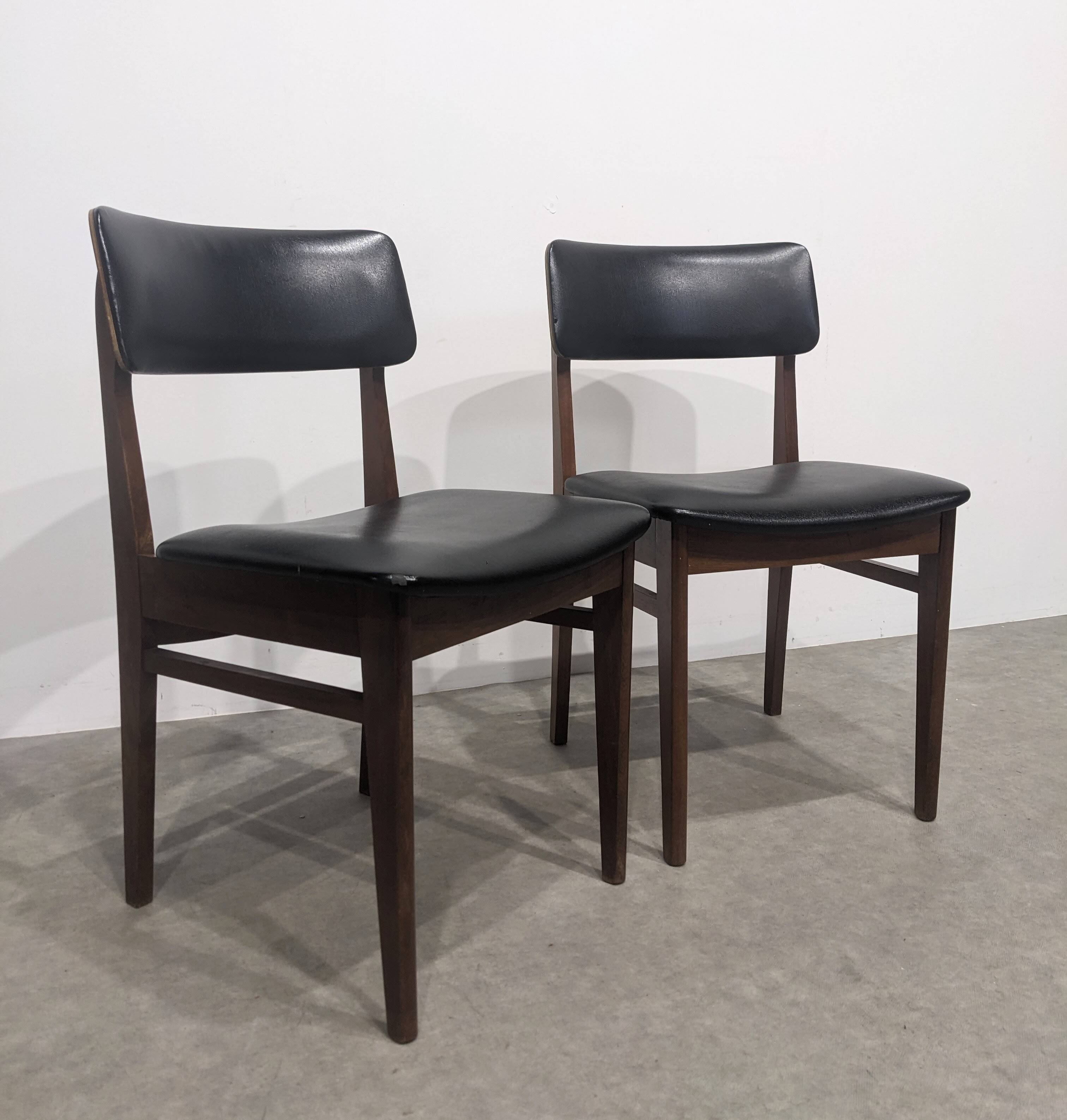 Two mid-century faux leather chairs