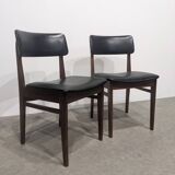 Two mid-century faux leather chairs