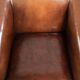 Sleek sheepskin Art Deco design armchair with black piping