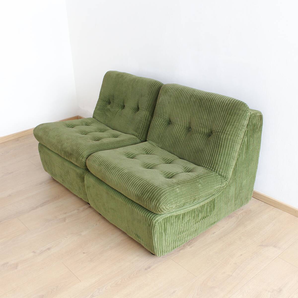 Modular vintage sofa with green cord upholstery