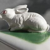 Pot terrine rabbit of Bavent in white earthenware on square of greenery