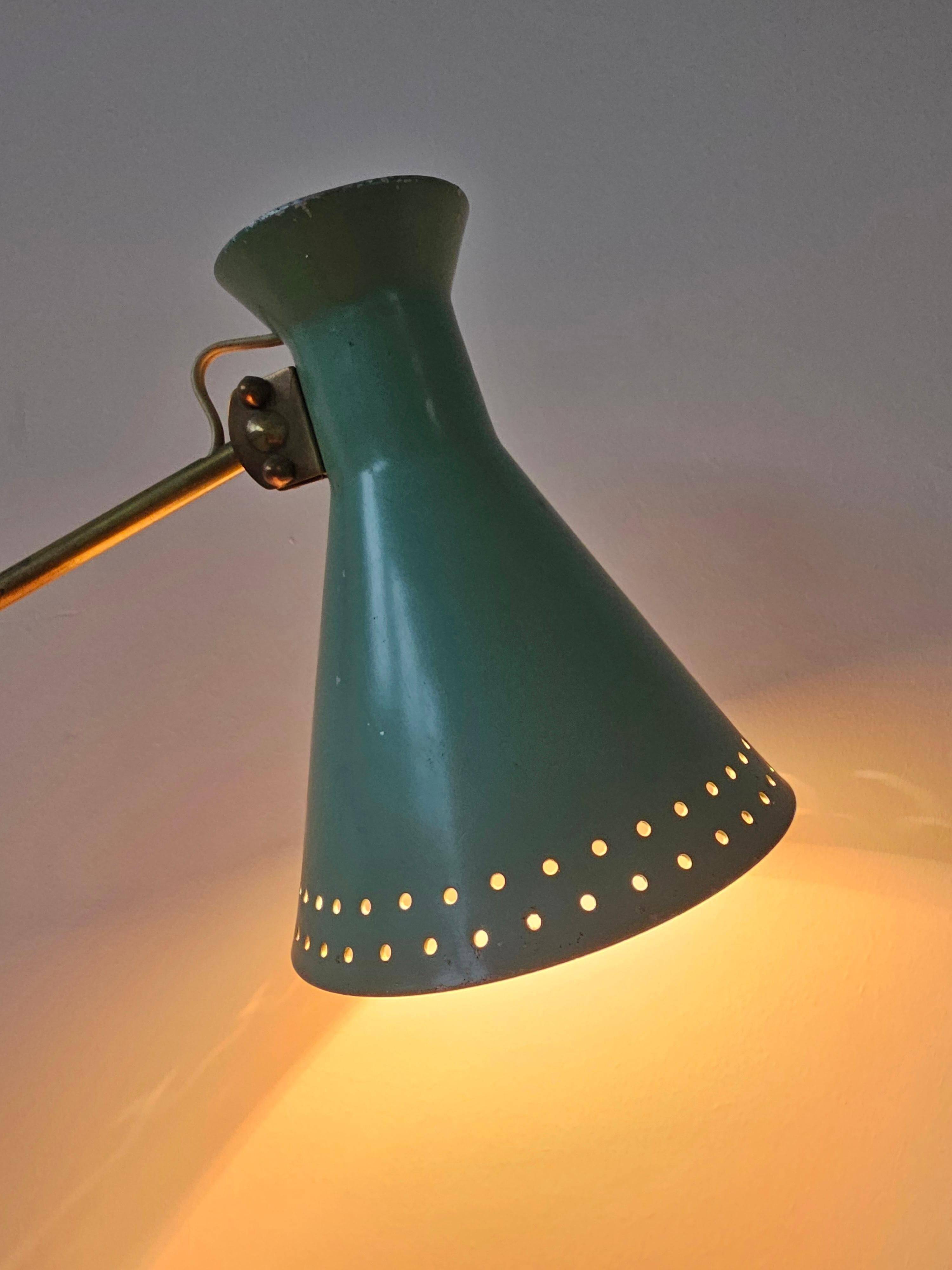 Mid-Century table lamp with a conical metal shade, attributed to Stilnovo.